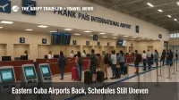 Travelers queue at Holguín's Frank País International check-in hall as flights resume, showing live boards and staffed counters after Melissa recovery