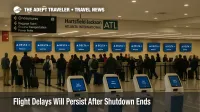 Travelers queue at ATL check-in counters during FAA ordered cuts, illustrating ongoing flight delays even as the government shutdown ends