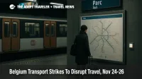 Traveler checking a real STIB network map on a Brussels Metro platform during Belgium transport strikes, subdued light and authentic wayfinding
