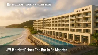 Oceanfront JW Marriott St. Maarten at Dawn Beach, warm light on the façade, turquoise water and low surf, resort adds a luxury option on the Dutch side