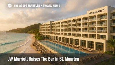 Oceanfront JW Marriott St. Maarten at Dawn Beach, warm light on the façade, turquoise water and low surf, resort adds a luxury option on the Dutch side