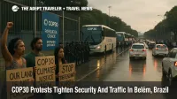 COP30 protesters and police outside Parque da Cidade in Belém with security fences and slow traffic near the main entrance.