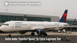 Delta Comfort Basic launch, Delta A321 at Atlanta concourse with gate and jet bridge, bright overcast, travelers visible through terminal windows