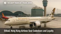 Etihad jet taxiing at Hong Kong International with a Hong Kong Airlines aircraft at the gate, illustrating the new codeshare and loyalty partnership