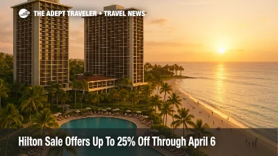 Hilton Hawaiian Village beachfront towers and pools at sunset, illustrating the Hilton Sale winter promotion and resort options for discounted stays