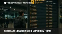 Travelers watch the departures board at Rome Fiumicino during Volotea and easyJet strike disruption in Italy on November 14 2025