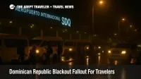 Travelers line up for hotel shuttles at Las Américas International Airport after a Dominican Republic blackout, with dim terminal lighting and police nearby
