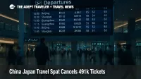 Travelers study departure screens in Narita International Airport as China Japan travel warning cuts flights and thins demand on key routes