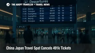 Travelers study departure screens in Narita International Airport as China Japan travel warning cuts flights and thins demand on key routes