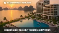Aerial view of InterContinental Halong Bay Resort with beachfront pools, modern towers, and limestone islands of Ha Long Bay in the background at sunset.