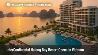 Aerial view of InterContinental Halong Bay Resort with beachfront pools, modern towers, and limestone islands of Ha Long Bay in the background at sunset.