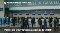 Travelers queue at Paris Charles de Gaulle check in counters as France's new fines for unruly airline passengers raise the stakes for in flight behaviour