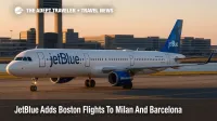 JetBlue Airbus A321 taxiing at Boston Logan with terminal and tower in view, illustrating new nonstop Boston flights to Milan and Barcelona