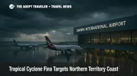 Storm clouds and wet tarmac at Darwin International Airport as Tropical Cyclone Fina approaches, highlighting potential flight disruption to the Northern Territory