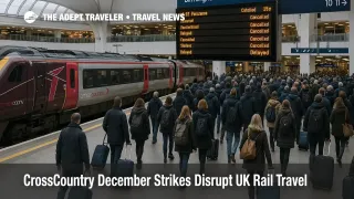 Travelers watch departure boards at Birmingham New Street as CrossCountry December rail strikes leave platforms busy and several services cancelled