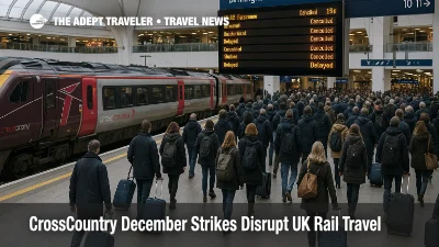 Travelers watch departure boards at Birmingham New Street as CrossCountry December rail strikes leave platforms busy and several services cancelled