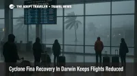 Travelers wait in Darwin International Airport departures hall as Cyclone Fina Darwin airport disruption keeps flights reduced during storm recovery