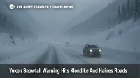 Vehicles crawl along a snow covered South Klondike Highway during a Yukon snowfall warning that makes Klondike and Haines border roads hazardous for drivers