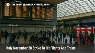 Travelers wait under departures boards in Roma Termini as the Italy November 28 transport strike disrupts trains and connections across the country