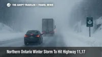 Cars and trucks crawl through heavy snow on Highway 11 during a Northern Ontario winter storm that disrupts Trans Canada travel between key towns