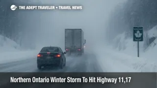 Cars and trucks crawl through heavy snow on Highway 11 during a Northern Ontario winter storm that disrupts Trans Canada travel between key towns