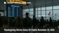 Travelers watch a delay filled departures board at JFK as Thanksgiving storms US flights disrupt holiday travel across the Northeast