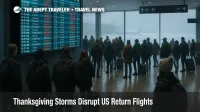 Travelers watch a departures board at Chicago O Hare as Thanksgiving storms disrupt US flights during the busy return travel weekend