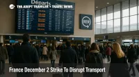 Travelers watch delayed departures at Paris Charles de Gaulle as the France December 2 transport strike disrupts airport and rail access plans