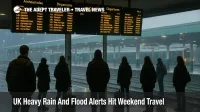 Passengers watch delay boards at Cardiff Central as UK heavy rain travel disruption and flood alerts slow weekend trains across south Wales