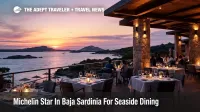 Guests dine at a Baja Sardinia Michelin star restaurant terrace at 7Pines Resort Sardinia, overlooking the sea at sunset.