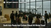 Passengers watch departure boards at Colombo airport as South Asia floods winter travel plans after Cyclone Ditwah