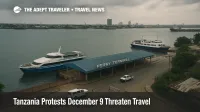 View of Dar es Salaam ferry terminal in Tanzania as services face Tanzania protests December 9 travel disruption, with ferries idle and cloudy skies over the harbor.