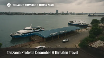View of Dar es Salaam ferry terminal in Tanzania as services face Tanzania protests December 9 travel disruption, with ferries idle and cloudy skies over the harbor.