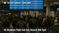 Travelers watch a departures board at Chicago O Hare as US shutdown flight cuts end but winter airport delays continue at the busy hub