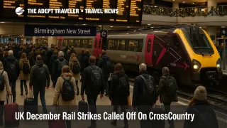 Travelers check departure boards at Birmingham New Street as CrossCountry December rail strikes are suspended but busy Christmas trains still strain capacity