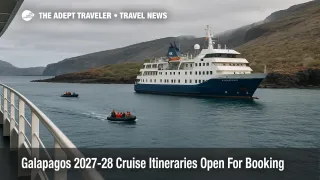 Small expedition ship off a rocky Galapagos shore as zodiacs land guests for new Galapagos 2027 28 cruise itineraries on Santa Cruz II