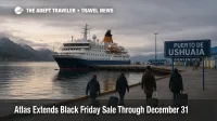 Small expedition cruise ship docked at Ushuaia port as travelers board, illustrating Atlas Black Friday cruise deal savings on polar voyages