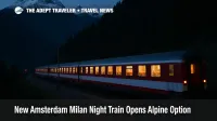Overnight Amsterdam to Milan night train crossing the Swiss Alps near Brig with snow capped peaks and lit coaches on a curving mountainside track.