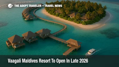 Aerial view of Vaagali Maldives resort opening 2026 with overwater villas, beach villas, and a speedboat arrival in South Male Atoll lagoon