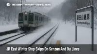 JR East winter stop skips at Omoshiroyama-Kogen show a train passing without stopping in snowy Tohoku.