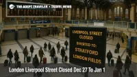 London Liverpool Street closure forces diverted routes as travelers with bags check diversion info inside the station