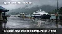Seychelles heavy rain alert at Mahe Inter Island Quay with wet roads, low clouds, and ferry disruption risk