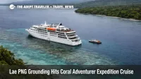 Coral Adventurer aground Lae disrupts Papua New Guinea expedition cruises, ship halted near reef under overcast skies