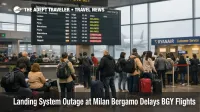 Milan Bergamo landing system outage, passengers wait under delay boards in BGY departures hall