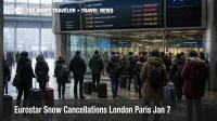 Eurostar snow cancellations London Paris, passengers check boards at St Pancras as trains are canceled in snow.
