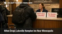 Hilton drops Lakeville Hampton Inn as a traveler stands at the front desk, with cancelled booking notices visible