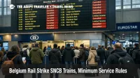 Belgium rail strike SNCB minimum service shown on Brussels Midi departures board with cancellations and queues.
