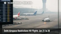 Delhi airspace restrictions flights shown by hazy Delhi airport ramp with aircraft holding during a midday shutdown window