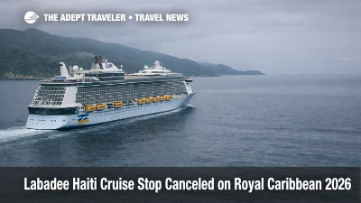 Labadee Haiti cruise stop canceled, a Royal Caribbean ship sails past the coast under gray skies after port calls are paused