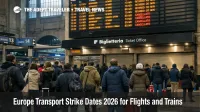 Europe transport strike dates shown by delays on a departures board inside Milan's main rail station with travelers waiting